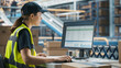 © Gorodenkoff - Caucasian Female Stocking Associate Using Desktop Computer To Check Inventory In Distribution Facility. Warehouse Worker Checking Orders on Automated Conveyor Belt