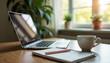 © Arra Vais - Cozy workspace with laptop, notebook, and coffee showcasing work from home environment. Work from home environment includes a laptop, notebook for notes, and a steaming cup of coffee.