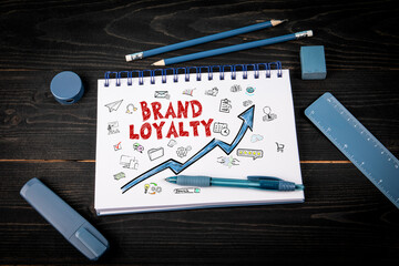 Wall Mural - notebook with brand loyalty concept and rising arrow illustration