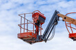 © Kalyakan - Articulate boom lift with blue sky background, Aerial platform lift telescopic boom lift hydraulic boom lift, Mobile construction crane, Construction boom lifts