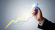 © MdMojibor - Visualizing Upward Economic Trajectory A Hand Draws an Ascending Arrow on a Graph Symbolizing Financial Growth and Positive Market Trends in Business