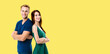 © vgstudio - Portrait of young happy smile cute couple, boyfriend, girlfriend, man wear blue casual cloth, and woman in green dress, isolated yellow background with free ad text space.