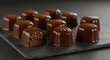 © SAE Stock - Gourmet Dark Chocolate Truffles on Slate Board Sweet Dessert Indulgence