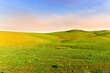 © Yaroslav - Countryside farm landscape of green field grassland in spring pr summer season with green fresh grass and beautiful sunset or sunrise cloudy sky on background