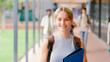 © Monkey Business - Portrait Of Smiling Female High School Or Secondary Student With Backpack Outside Classroom