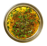 Glass jar with italian dressing and herbs on transparent background