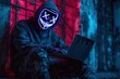 © Tanu - Mysterious individual using laptop in urban setting with neon mask and eerie lighting at night