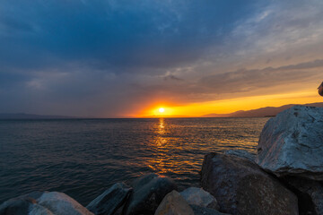 Wall Mural - Beautiful sunset over the lake and mountains.