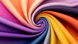 © Gefo - Vibrant swirl of colorful fabric sheets creating an eye-catching spiral pattern showcasing various hues