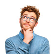 © FS - A young man with curly hair and glasses is thoughtfully looking up with his hand on his chin.