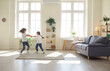 © Studio Romantic - Happy children playing at home. Two joyful kids having fun in new spacious apartment. Brother and sister enjoying weekend and playing in big light living room together. Family, home, children concept