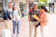 © Art_Photo - Senior asian tourism travel group reading guidebook together with smiles, enjoy retirement, friendly active aging tourism, senior health and wellness, retirement life insurance and vacation planning
