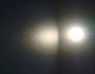 Wall Mural - Blue spotlight glows in the dark night sky with a bright gradient flash and star texture