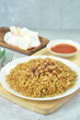 © Afif - Delicious chicken fried rice with egg, chilli, crackers and green onion, Indonesian dish.