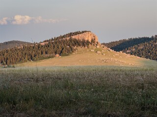 Wall Mural - rock outcrop in the bighorn mountains illuminated by the setting sun