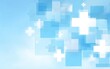 © Jufri - Light-blue background with translucent squares and white plus signs.  Soft, blurred, medical-themed design