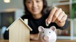 © SD AI - Woman saving money in piggy bank for home ownership, financial planning for future real estate investment and mortgage saving goals, illustrative concept of personal finance and property acquisition
