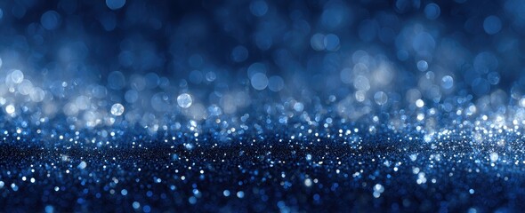 Deep blue glitter background with bokeh