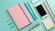 © StockVibes - Flat lay of pink notebook and colorful stationery on a teal background