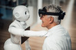 © Westend61 - Human and robot interaction in medical research and learning environment