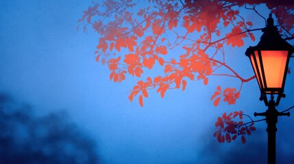 Wall Mural - a serene evening scene with a glowing street lamp surrounded by autumn leaves against a twilight sky