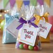 © SashaMagic - Colorful gift bags with thank you tags for festive occasions.