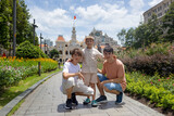 Family with children, boys, visiting Ho Chi Minh city, Saigon, fot a holiday, enjoying asian culture
