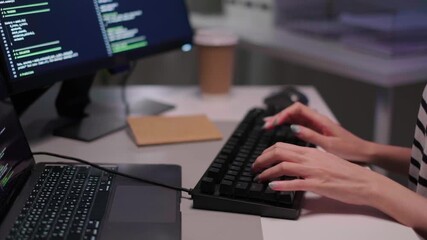 Close-up woman hand typing coding keyboard software developers programmer engineer network web application laptop