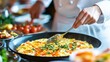 © Jagone Mas Zan - Chef preparing a savory omelet station