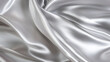 © Robin - Luxurious flowing silver satin fabric with soft folds and elegant sheen
