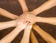 © Tanoiii - group of people holding hands