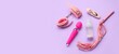 © Pixel-Shot - Bottle of lubricant and sex toys on lilac background with space for text, top view