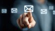 © The Little Hut - Email Marketing Concept: Man Touching Holographic Email Icon for Digital Communication and Connectivity