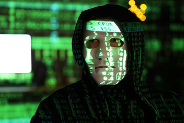 hacker and projection of programming code in dark room, closeup