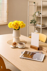 Poster - vase with beautiful narcissus flowers on dining table in interior of living room