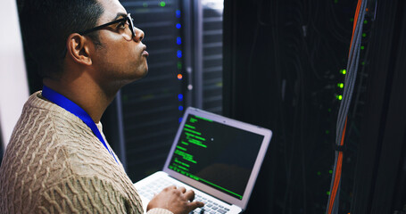 man, thinking and server room with laptop screen for network engineering or cybersecurity. male pers