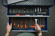 © Westend61 - Open toolbox with organized tools in a workshop garage setting