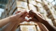 © Anna - Unity and diversity concept with multiracial hands forming heart shape in warehouse setting,World Humanitarian Day