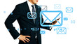 © Who is Danny - Businessman in suit holding smartphone with floating email icons on white background, symbolizing digital communication and online messaging