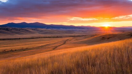 Wall Mural - serene sunset over rolling hills with vibrant colors and distant mountains, evoking tranquility and 