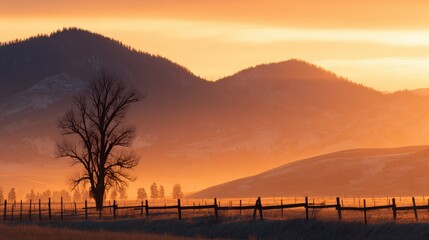 Wall Mural - serene sunset over rolling hills with a lone tree and wooden fence, creating a tranquil rural landsc