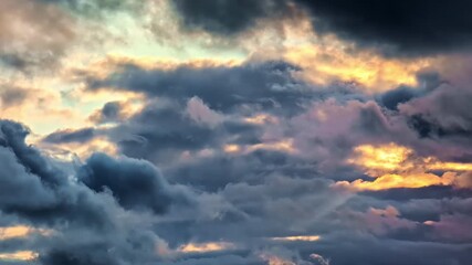 Wall Mural - Dark Clouds Illuminated By Sunset Backlit. Slow Motion