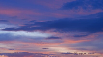 Wall Mural - a peaceful sunrise time-lapse captures the horizon glowing in warm oranges and soft purples, as clou