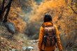 © Daniel - Forest hike trail hiker woman walking in autumn fall nature background in fall season. Hiking active people lifestyle wearing backpack exercising outdoors.