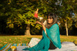 © ADDICTIVE STOCK - Woman practicing autumn mindfulness in nature