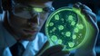 © Dexter - Male scientist observing glowing bacteria in a petri dish in a modern lab environment.