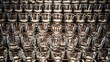 © Sameera - A detailed close up view of many small empty shot glasses arranged in neat rows on a metal rack surface