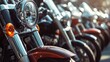 © Suphawan - Close-up view of a row of motorcycles, focusing on handlebars and mirrors, creating depth and perspective