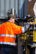 © Austockphoto - young mechanic tradie using workshop mate press tool workstation to repair car components