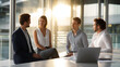 © Nataliya - Business team collaborating on strategies in a modern office